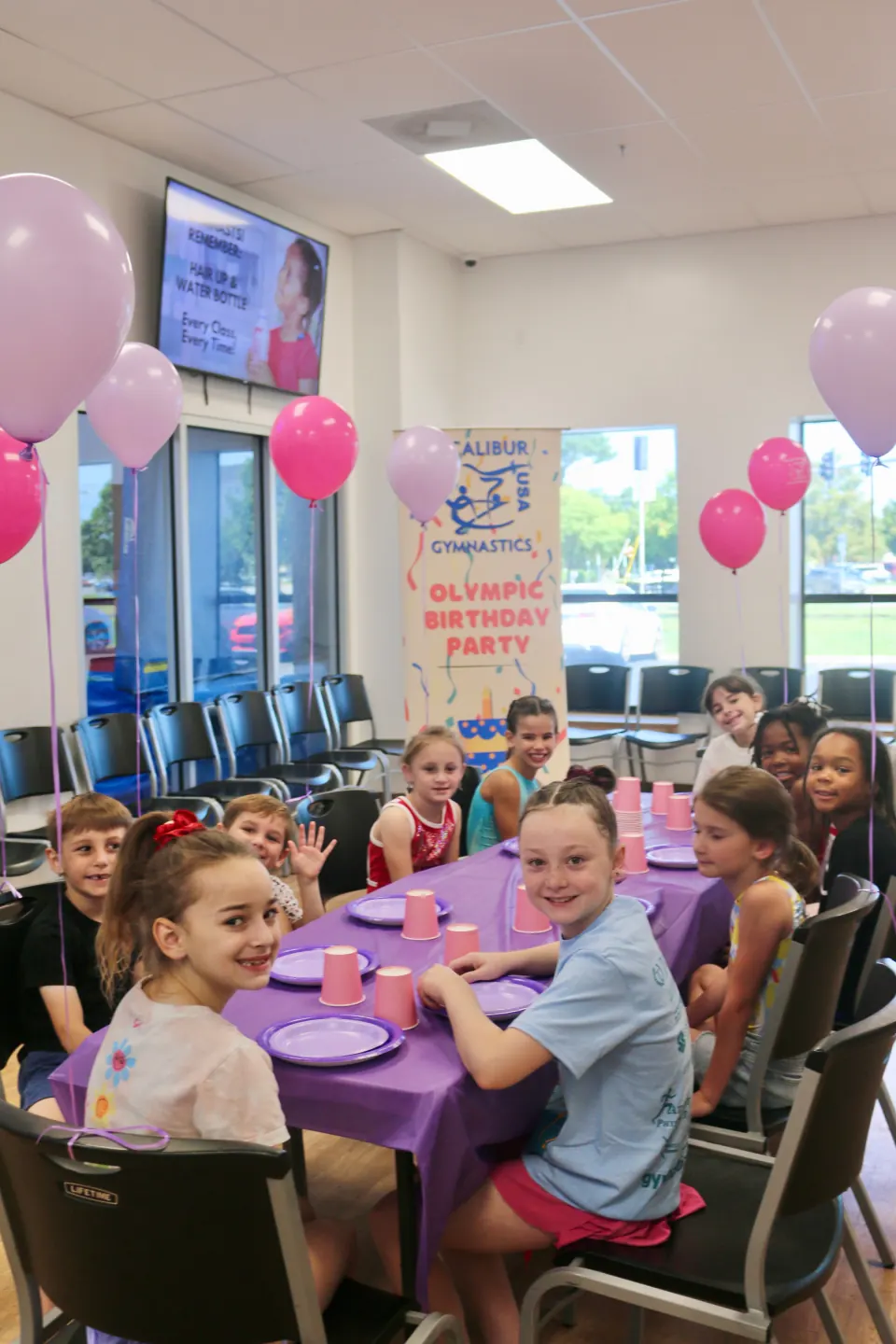 Children celebrating a birthday party at Excalibur Gymnastics
