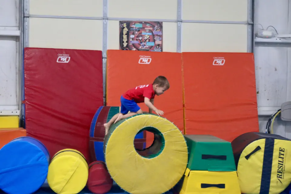 Children enjoying an active preschool gymnastics class
