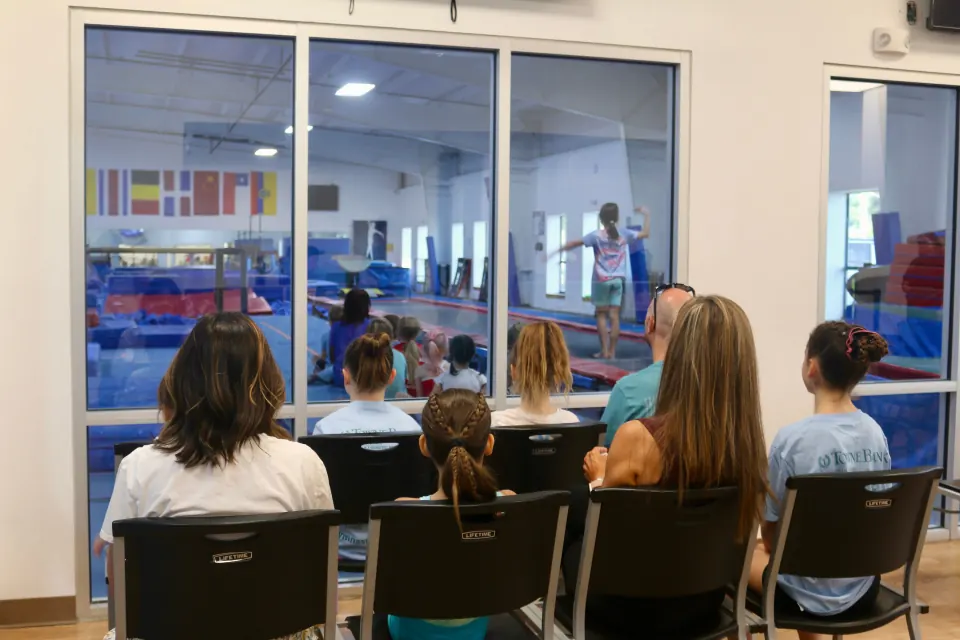 Preschool gymnasts moving through a class activity